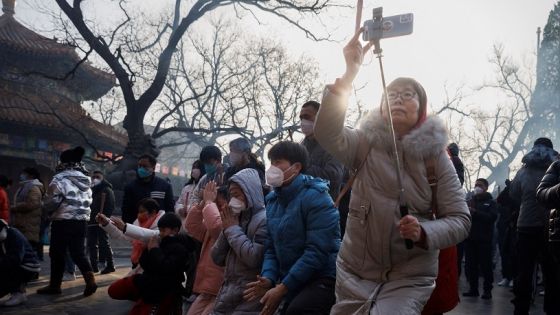 People pray at Lama Temple (Yonghe Temple) on the first day of the Lunar New Year of the Rabbit in Beijing, China, January 22, 2023. REUTERS/Thomas Peter