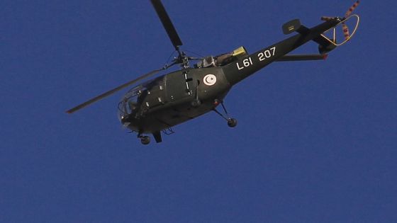 A Tunisian army helicopter flies over the capital Tunis January 15, 2011. Hundreds of soldiers patrolled the streets of the Tunisian capital on Saturday where the prime minister was due to meet opposition parties to try to form a coalition after protests swept the president from power. REUTERS/Zohra Bensemra (TUNISIA- Tags: POLITICS CIVIL UNREST TRANSPORT MILITARY)