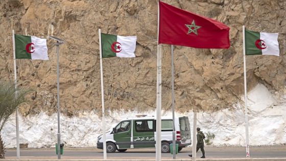 A picture taken from the Moroccan region of Oujda shows Algerian border guards patrolling along the border with Morocco on November 4, 2021. Algeria has accused its arch-rival Morocco of killing three Algerians on a desert highway, as tensions escalate between the neighbours over the contested Western Sahara. (Photo by FADEL SENNA / AFP)