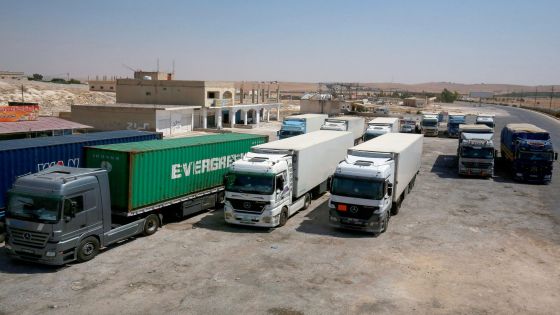 Long-haul trucks are parked by the closed Jaber/Nassib border post at Jordan's border with Syria, on August 1, 2021. Jordan announced a day earlier the decision to close the Jaber/Nassib border post with Syria "temporarily" as a result of security developments in the southern province of Daraa after the deadliest flareup in three years killed 28 people. (Photo by Khalil MAZRAAWI / AFP)