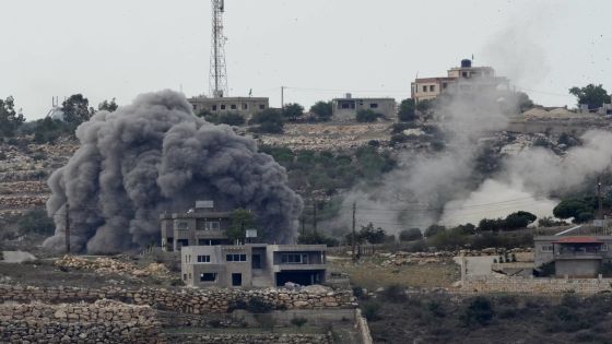 Smoke rises from an Israeli airstrike, left, and artillery shelling, right, on the outskirts of Aita al-Shaab, a Lebanese border village with Israel in south Lebanon, Monday, Nov. 13, 2023. Israeli troops and Hezbollah militants and their allies have been clashing along the border since the Israel-Hamas war started five weeks ago with a bloody incursion into southern Israel by Hezbollah ally Hamas. (AP Photo/Hussein Malla)