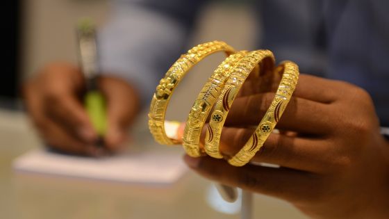An Indian salesperson calculates the price of gold bracelets at a jewellers in Hyderabad on July 22, 2015. Gold fell by INR 108 to trade at INR 24,689 per 10 grams in futures trade July 22, 2015, largely in line with a weak trend overseas. Analysts said gold retreated amid a weakening trend in the overseas markets for the tenth straight day as Goldman Sachs Group predicted further decline in its prices and holdings. AFP PHOTO/NOAH SEELAM (Photo credit should read NOAH SEELAM/AFP/Getty Images)