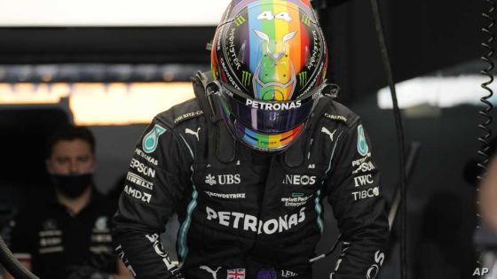 Mercedes driver Lewis Hamilton of Britain wears a new rainbow helmet during practice session in Lusail, Qatar, Saturday, Nov. 20, 2021 ahead of the Qatar Formula One Grand Prix. (AP Photo/Darko Bandic)