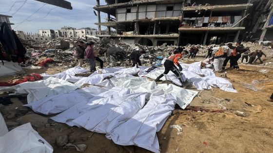 BEIT LAHIA, GAZA - MARCH 04: Shrouded bodies of dozens of Palestinians, who lost their lives during the Israeli army raids, and buried in a mass grave due to the siege at the time, are taken out to be buried in official cemeteries near Kemal Adnan hospital in Beit Lahia, Gaza Strip on March 04, 2025. According to civil defense officials, the mass grave was destroyed by Israeli construction equipment and the bodies of 40 people have been exhumed so far. ( Hasan N. H. Alzaanin - Anadolu Agency )