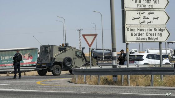 Israeli police stand guard near the site of a deadly shooting attack where Israeli officials say three people were shot and killed at the Allenby Bridge Crossing between the West Bank and Jordan, Sunday, Sept. 8, 2024. (AP Photo/Mahmoud Illean)