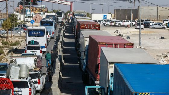 Trucks and people wait to cross into Syria through the Jaber-Nassib border crossing after the Jordanian government allowed for the transport of goods to resume, on December 19, 2024. Islamist-led rebels took Damascus in a lightning offensive on December 8, ousting president Bashar al-Assad and ending five decades of Baath rule in Syria. (Photo by Khalil MAZRAAWI / AFP) (Photo by KHALIL MAZRAAWI/AFP via Getty Images)