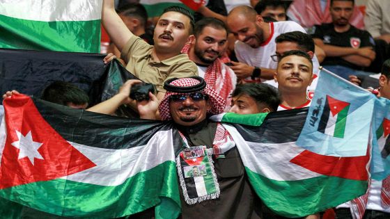 Jordan's fans cheer as they watch the 2026 FIFA World Cup Asian Qualifier football match between Jordan and Oman on big screens at the Prince Hamza hall in the Sports City in Amman on June 5, 2025. (Photo by Khalil MAZRAAWI / AFP) (Photo by KHALIL MAZRAAWI/AFP via Getty Images)