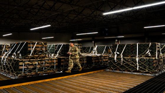 DOVER, DE October 12, 2022: An Airman checks the paperwork of pallets of ammunition, weapons and other equipment bound for Ukraine at a storage bunker at Dover Air Force Base in Dover, Delaware on Wednesday, October 12, 2022. The artillery ammunition cargo is bound for Ukraine via a commercial plane.
(Photo by Demetrius Freeman/The Washington Post via Getty Images)