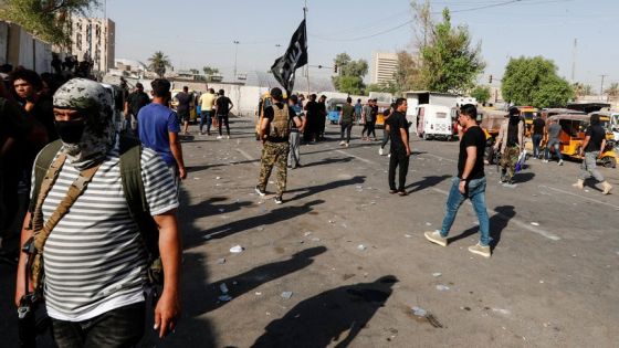 Members of Sadr's Peace Brigades fighters gather during clashes with the Iraqi security forces near the Green Zone, in Baghdad, Iraq August 30, 2022. REUTERS/Thaier Al-Sudani