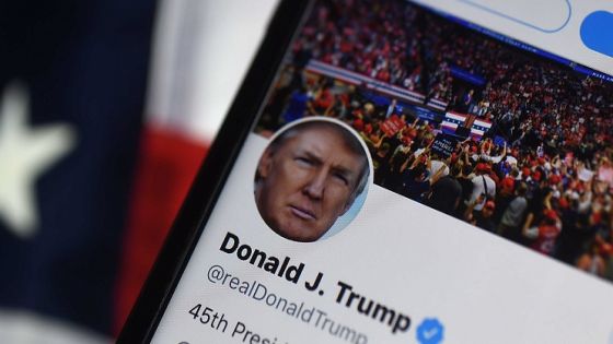 In this photo illustration, the Twitter account of US President Donald Trump is displayed on a mobile phone on August 10, 2020, in Arlington, Virginia. - Wall Street was mixed early Monday, with Nasdaq retreating further as investors digested President Donald Trump's efforts to take unilateral action in the absence of a deal with Congress on emergency pandemic spending. (Photo by Olivier DOULIERY / AFP)