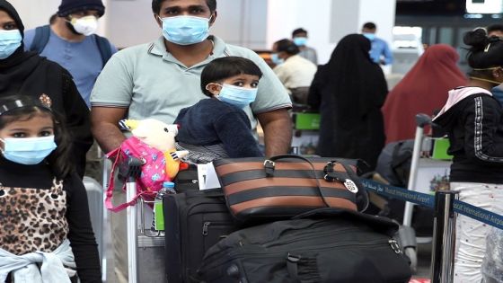 Members of an Indian family check in at the Muscat International Airport before leaving the Omani capital on a flight to return to their country, on May 9, 2020, amid the novel coronvirus pandemic crisis. - India has been bringing home hundreds of thousands of its citizens stuck abroad after it banned all incoming international flights in late March in a bid to control the coronavirus crisis, leaving vast numbers of workers and students stranded. (Photo by MOHAMMED MAHJOUB / AFP) (Photo by MOHAMMED MAHJOUB/AFP via Getty Images)