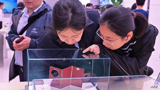 Visitors take a look at Huawei Mate XT, a new triple-folding phone, at a Huawei store in Beijing on September 10, 2024. Chinese tech giant Huawei on September 10 unveiled the world's first triple-folding phone at more than three times the price of the newest iPhone, hours after its US competitor lifted the curtain on its own new handset built for AI. (Photo by ADEK BERRY / AFP)