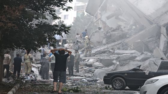 TEHRAN, IRAN - JUNE 13: People look over damage to buildings in Nobonyad Square following Israeli airstrikes on June 13, 2025 in Tehran, Iran. Iran's three top military generals were killed in the attacks that also targeted nuclear and military facilities, according to published reports. Israel described the strikes as preemptive to keep Iran from obtaining nuclear weapons, the reports said. (Photo by Majid Saeedi/Getty Images)