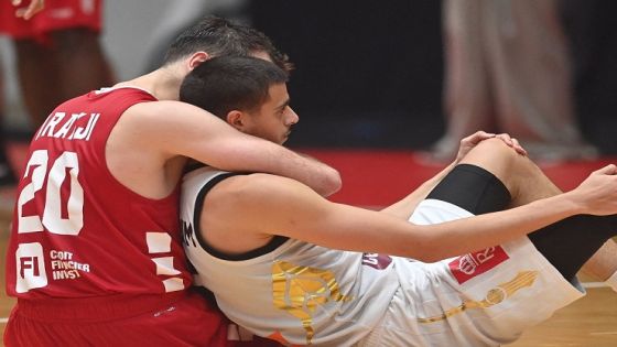 Lebanons Wael Arakji (L) hugs Jordans Freddy Ibrahim after Lebanon won at the end of the 2022 FIBA Asia Cup semifinal match at the Istora Senayan in Jakarta on July 23, 2022. (Photo by ADEK BERRY / AFP) (Photo by ADEK BERRY/AFP via Getty Images)