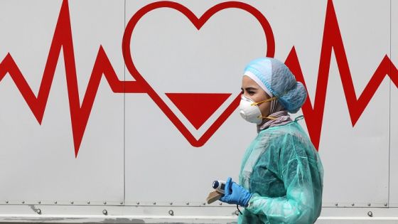 A Jordanian doctor walks next a mobile clinic that is operated as part of initiative that was launched with the aim of providing Jordanians with field medical services, amid concerns over the spread of the coronavirus disease (COVID-19), in Amman, Jordan, March 30, 2020. Picture taken March 30, 2020. REUTERS/Muhammad Hamed - RC2YUF9FKPPE