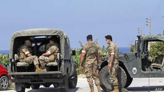 Lebanese soldiers stand guard in the southern Lebanese town of Qlaile on May 14, 2021. - Three rockets were fired from southern Lebanon towards Israel, a Lebanese military source said. Israel's army confirmed the attack and said the rockets landed in the sea. It was not immediately clear who had fired them, but two sources close to Israel's arch-enemy Hezbollah said the Lebanese Shiite group had no link to the incident. (Photo by Mahmoud ZAYYAT / AFP)