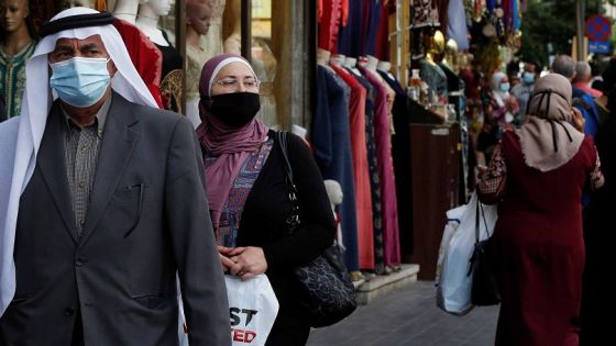 People, some wearing protective masks, walk in downtown Amman, amid fears over rising numbers of the coronavirus disease (COVID-19) cases, Jordan November 4, 2020. REUTERS/Muhammad Hamed