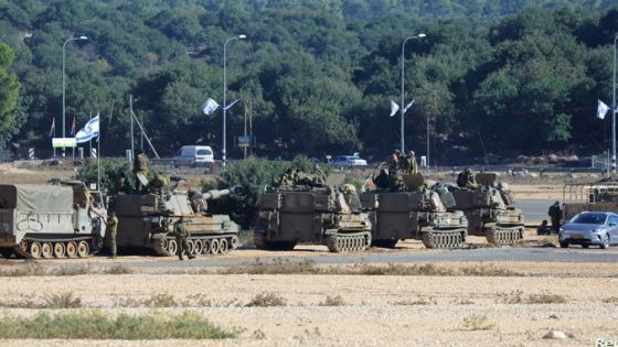 Soldiers stand on military vehicles, near the border with Lebanon, in northern Israel, November 8, 2023. REUTERS/Alexander Ermochenko