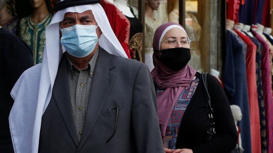 People, some wearing protective masks, walk in downtown Amman, amid fears over rising numbers of the coronavirus disease (COVID-19) cases, Jordan November 4, 2020. REUTERS/Muhammad Hamed