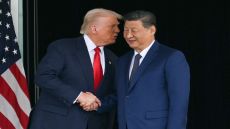 TOPSHOT - US President Donald Trump (L) and China's President Xi Jinping shake hands as they leave after their talks at the Gimhae Air Base, located next to the Gimhae International Airport in Busan on October 30, 2025. US President Donald Trump and China's leader Xi Jinping opened on October 30 their first face-to-face meeting in six years, seeking a truce to end a trade war that has roiled the world economy. (Photo by ANDREW CABALLERO-REYNOLDS / AFP) (Photo by ANDREW CABALLERO-REYNOLDS/AFP via Getty Images)