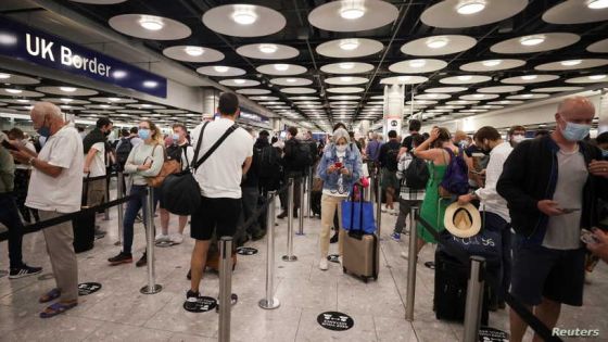 FILE PHOTO: Arriving passengers queue at UK Border Control at the Terminal 5 at Heathrow Airport in London, Britain June 29, 2021. REUTERS/Hannah Mckay/File Photo