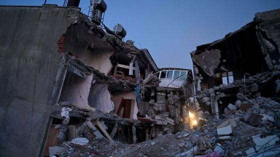 A picture taken on February 14, 2023 shows collapsed buildings as rescue teams continue to search victims and survivors, more than a week after a 7.8 magnitude earthquake struck the border region of Turkey and Syria, in Kahramanmaras on February 14, 2023 (Photo by OZAN KOSE / AFP)