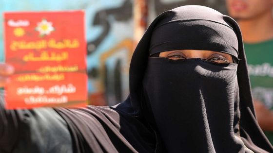 A Jordanian woman casts her ballot in parliamentary elections at a polling station in Amman Jordan, Tuesday, Sept. 20, 2016. Jordanians are voting for a new parliament under revised rules meant to strengthen political parties -- an election seen as a small step toward democratic reform. More than 4 million residents of the pro-Western monarchy are eligible to vote for a 130-member parliament, with 27 seats reserved for women, Christians and ethnic minorities. (AP Photo/Raad Adayleh)