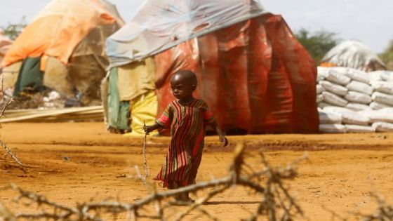 A child walks outside makeshift shelters at the Kaxareey camp for the internally displaced people after they fled from the severe droughts, in Dollow, Gedo Region, Somalia May 24, 2022. Picture taken May 24, 2022. REUTERS/Feisal Omar