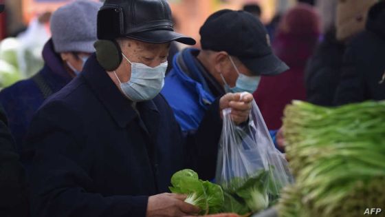 Customers shop for vegetables at a market in Nanjing, in China's eastern Jiangsu province on January 11, 2021. (Photo by STR / AFP) / China OUT