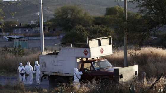 Police inspect an abandoned truck that was modified into a ram, found on the outskirts of Tula after a gang rammed several vehicles into a prison and escaped with nine inmates, in Tula, Mexico, Wednesday, Dec. 1, 2021. (AP Photo/Ginnette Riquelme)