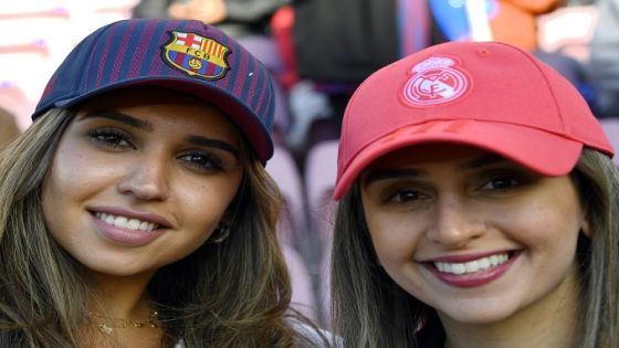 Two fans pose before the Spanish league football match between FC Barcelona and Real Madrid CF at the Camp Nou stadium in Barcelona on October 28, 2018. (Photo by GABRIEL BOUYS / AFP) (Photo credit should read GABRIEL BOUYS/AFP/Getty Images)