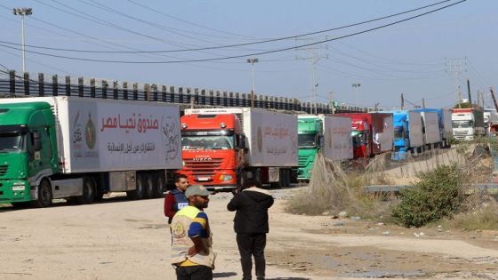 Trucks carrying humanitarian aid enter the Gaza Strip via the Rafah crossing with Egypt, hours after the start of a four-day truce in battles between Israel and Palestinian Hamas militants, on November 24, 2023. A four-day truce in the Israel-Hamas war began on November 24, with hostages set to be released in exchange for prisoners in the first major reprieve in seven weeks of war that have claimed thousands of lives. (Photo by SAID KHATIB / AFP)
