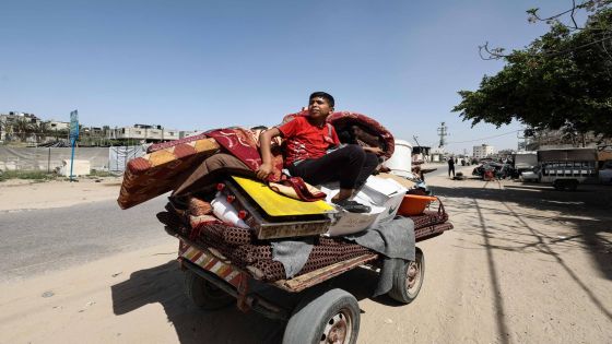 A boy sits on a cart loaded with belongings as Palestinians flee Rafah towards Khan Yunis in the southern Gaza Strip, on April 2, 2025. Israel's Defence Minister announced on April 2, a major expansion of military operations in Hamas-run Gaza, saying the army would seize "large areas" of the Palestinian territory. (Photo by Eyad BABA / AFP)