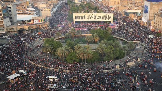 (FILES) In this file photo taken on October 28, 2019, Iraqi demonstrators stand at Tahrir Square in Baghdad during ongoing anti-government demonstrations. - In October 2019, unprecedented demonstrations across Iraq demanded the downfall of the ruling class. But after a year, a new government and nearly 600 protesters killed, virtually nothing has changed. (Photo by - / AFP)