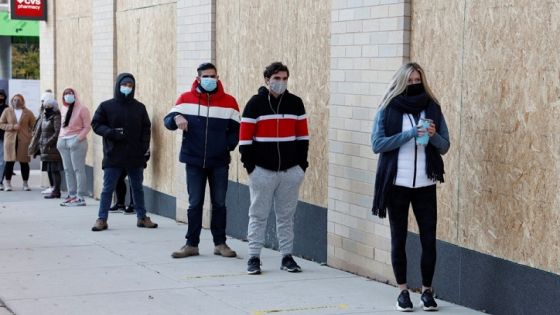 Voters wait in a socially distanced line to vote in the 2020 U.S. presidential election in Philadelphia, Pennsylvania, U.S. November 3, 2020. REUTERS/Rachel Wisniewski