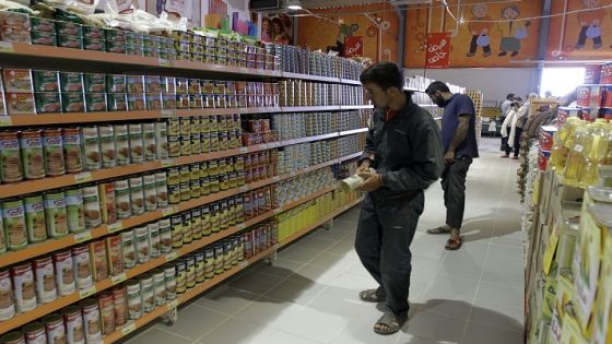 Syrian refugees look at cans displayed on the shelves of a supermarket at a refugee camp that opened in Azraq, in the Jordanian eastern desert, some 100 kilometres (62 miles) east of Amman on April 30, 2014 on its opening day. The 15-square-kilometre (5.7-square-mile) Azraq camp can accomodate up to 50,000 people but the UN agency for refugees UNHCR says it can be expanded to take in 130,000, making it one of the biggest in the world. AFP PHOTO/KHALIL MAZRAAWI (Photo credit should read KHALIL MAZRAAWI/AFP/Getty Images)