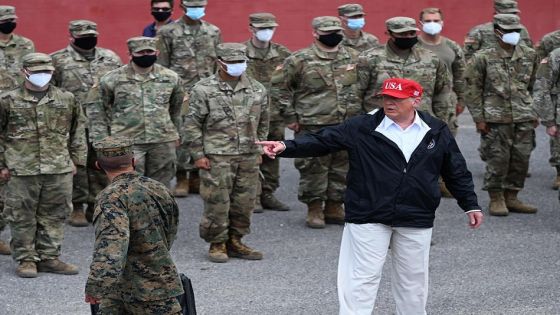 US President Donald Trump poses with National Guard troops in Lake Charles, Louisiana, on August 29, 2020. Trump surveyed damage in the area caused by Hurricane Laura. - At least 15 people were killed after Laura slammed into the southern US states of Louisiana and Texas, authorities and local media said on August 28. (Photo by ROBERTO SCHMIDT / AFP) (Photo by ROBERTO SCHMIDT/AFP via Getty Images)