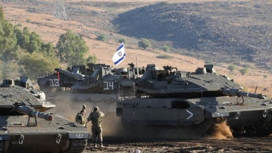 An Israeli Merkava tank drives into position in the north of Israel near the border with Lebanon on October 15, 2023. (Photo by Jalaa MAREY / AFP)