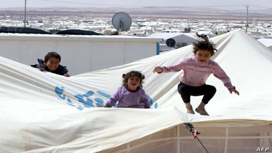 A picture taken on March 15, 2014 shows children playing at the sprawling desert Zaatari refugee camp in northern Jordan near the border with Syria which provides shelter to around 100,000 Syrian refugees. Syrian refugees in the seven-square-kilometre (2.8-square-mile) Zaatari camp in Jordan fear that President Bashar al-Assad's likely re-election this year will leave their dream of a return home as distant as ever. The brutal war in Syria between the regime and its foes shows no sign of abating and has killed at least 146,000 people since it erupted in mid-March 2011. And 2.5 million Syrians have fled abroad and another 6.5 million have been internally displaced. Jordan is home to more than 500,000 of the refugees. AFP PHOTO/KHALIL MAZRAAWI / AFP PHOTO / KHALIL MAZRAAWI