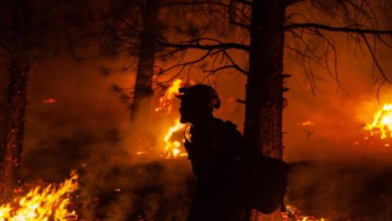 epa09354392 A handout photo made available by the US Forest Service (USFS) shows a firefighter during nighttime firefighting operations at the Bootleg Fire, in southern Oregon, USA, 15 July 2021 (issued 20 July 2021). According to the USFS, over 2,000 firefighters in the US state of Oregon are battling the Bootleg Fire, a large active wildfire that has burned over 300,000 acres, prompting the evacuation of thousands. EPA-EFE/US FOREST SERVICE HANDOUT HANDOUT EDITORIAL USE ONLY/NO SALES