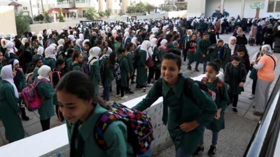 Students line up to enter their classrooms at one of the public schools during the first day after the end of teachers' one-month strike in Amman, Jordan, October 6, 2019. REUTERS/Muhammad Hamed