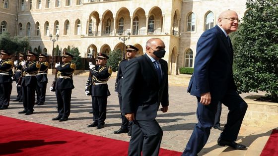 Jordanian Prime Minister Bisher al-Khasawneh walks with Lebanese Prime Minister Najib Mikati at the government palace in Beirut, Lebanon September 30, 2021. REUTERS/Mohamed Azakir