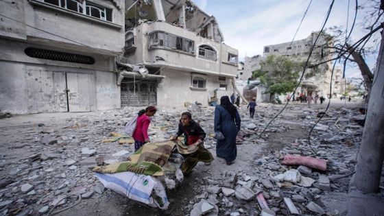 Palestinian children salvage some items found amid the destruction caused by Israeli bombing in Bureij in the central Gaza Strip on March 14, 2024, as the war between Israel and the Hamas movement continues. (Photo by AFP)