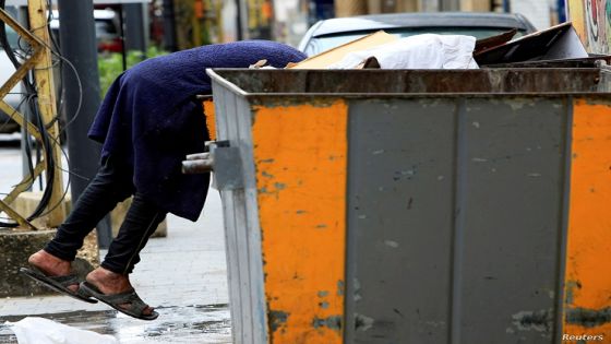 A man searches through a garbage bin, during a countrywide lockdown to combat the spread of coronavirus disease (COVID-19) in Sidon, southern Lebanon April 1, 2020. Picture taken April 1, 2020. REUTERS/Ali Hashisho TPX IMAGES OF THE DAY