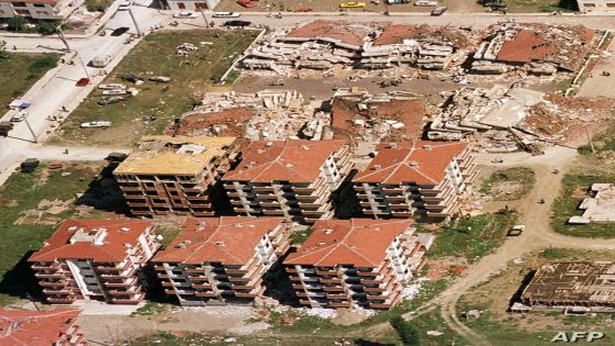 Destroyed apartment buildings are seen next to relatively undamaged ones in this aerial view of Sakarya, Turkey, after the earthquake on Tuesday, August 17, 1999. When rural Turks by the millions poured into Istanbul and the other western cities in recent years looking for work, contractors made a killing by throwing up slapdash, concrete-and-cinderblock apartment blocks to house them. (AP Photo/Str)