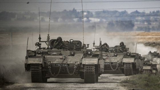 A column of Israeli army military armoured vehicles moves near the Gaza border in southern Israel on October 14, 2023. Thousands of people, both Israeli and Palestinians have died since October 7, 2023, after Palestinian Hamas militants entered Israel in a surprise attack leading Israel to declare war on Hamas in the Gaza Strip enclave on October 8. (Photo by Aris MESSINIS / AFP)