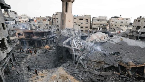 People stand among the rubble of a destroyed mosque during Israeli air strikes, in Gaza City on October 9, 2023. Israeli troops fought to regain control of the desert around the Gaza Strip and evacuate people from the embattled border area on October 9, 2023, as the death toll from the war with Hamas surged above 1,100 by the third day of clashes. (Photo by Mahmud HAMS / AFP)