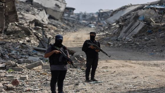 Hamas militants guard an area where they are searching for the bodies of hostages with the help of the International Committee of the Red Cross (ICRC) in Gaza City on November 3, 2025. The October 10 ceasefire in the two-year-long Israel-Hamas war, brokered by US President Donald Trump, has been sorely tested by continued Israeli strikes and claims of Palestinian attacks on Israeli soldiers. Since the start of the truce, Hamas has released the 20 surviving hostages and begun handing over the remains of 28 deceased captives. (Photo by Omar AL-QATTAA / AFP)