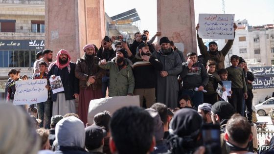 Demonstrators rally in the town of Idlib in Syria's northwestern Idlib province on March 1, 2024, to protest against Hayat Tahrir al-Sham (HTS), an Islamist group led by Al-Qaeda's former Syria branch, and calling for the overthrow of the group's leader. HTS and other groups control swathes of Idlib province and parts of neighbouring Aleppo, Hama and Latakia provinces. A brutal Syrian government crackdown on Arab Spring-inspired protests that erupted in 2011 spiralled into a devastating war involving foreign armies, militias and jihadists. (Photo by OMAR HAJ KADOUR / AFP)