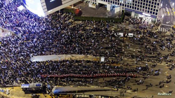 An aerial view shows Israeli women wearing red capes as they demonstrate against Prime Minister Benjamin Netanyahu's new right-wing coalition and its proposed judicial reforms to reduce powers of the Supreme Court, in Tel Aviv, Israel February 25, 2023. REUTERS/Ilan Rosenberg